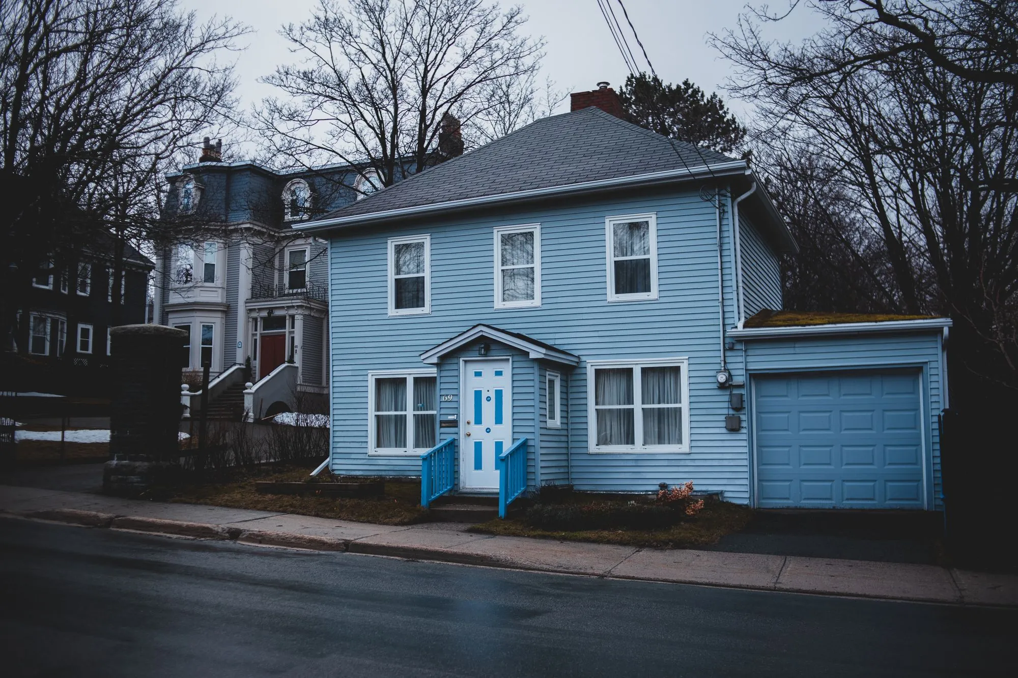 A clapboard house exterior with light-coloured siding